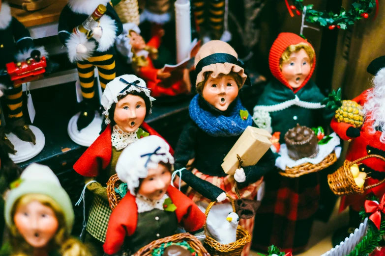 a close up of some christmas toys in front of a fireplace