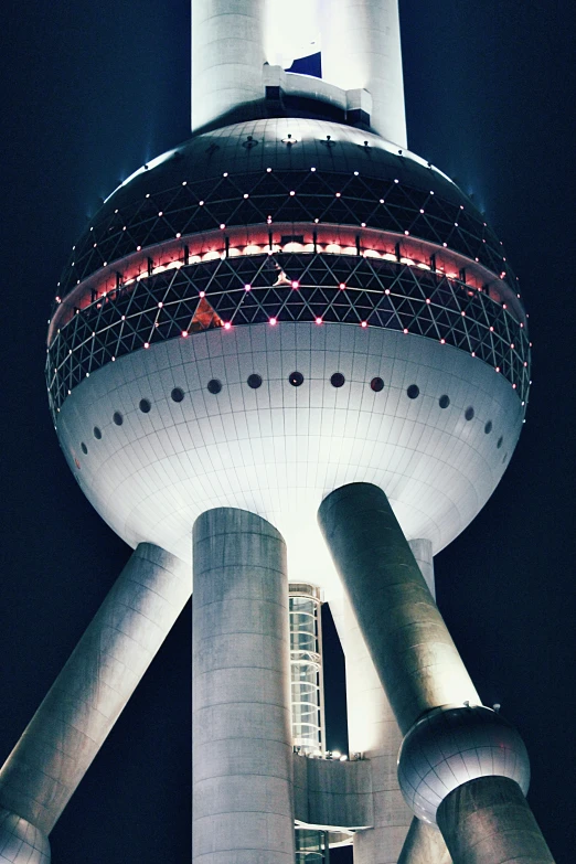 a tall tower sitting next to a tall white building