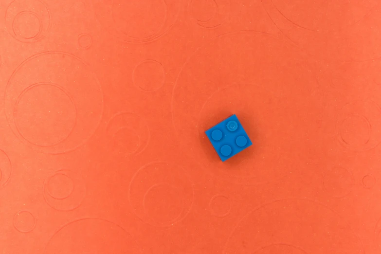 a lego block is shown on an orange background