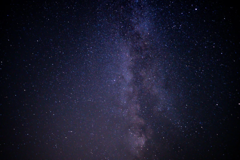 a night sky with a very large star that is almost visible