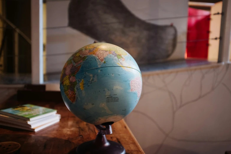 a globe and some books on a table