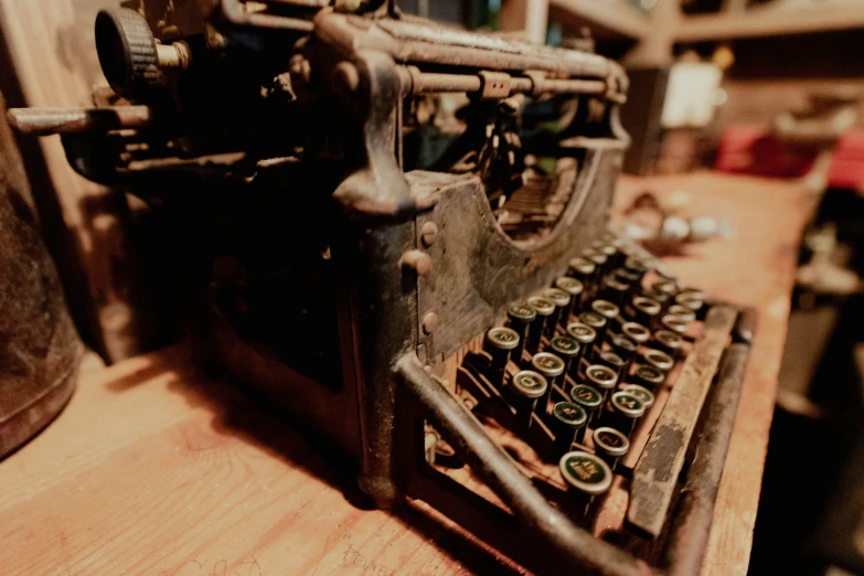 an old typewriter on a wooden table