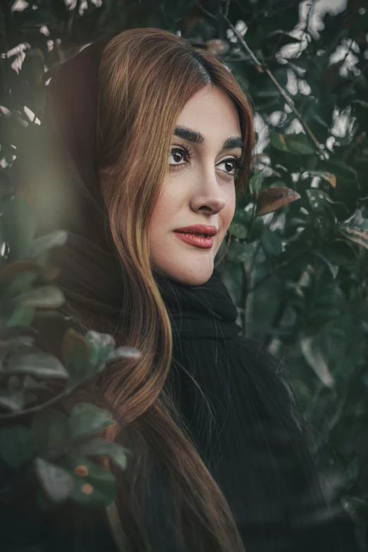 a woman with long hair and make - up looks into the distance