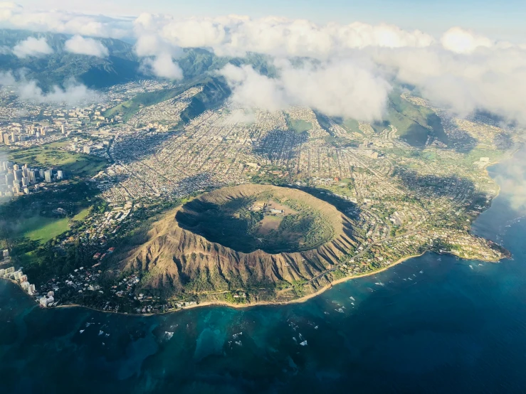 aerial view of a city and land area near the ocean