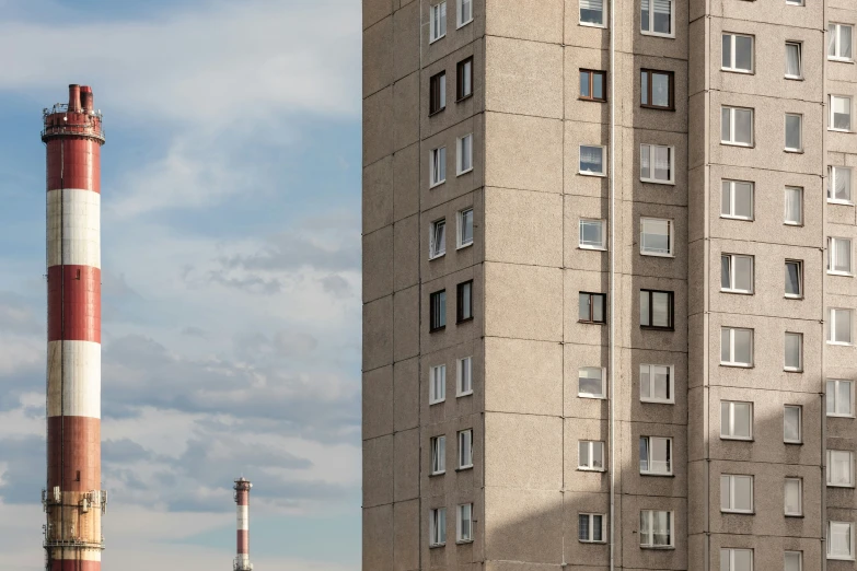 two buildings with windows next to each other