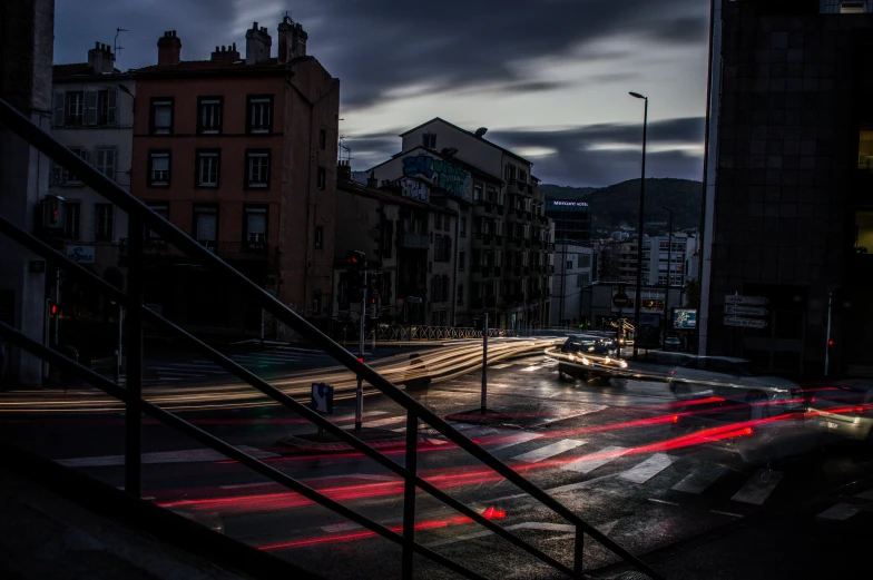 the view of a street in a city at night