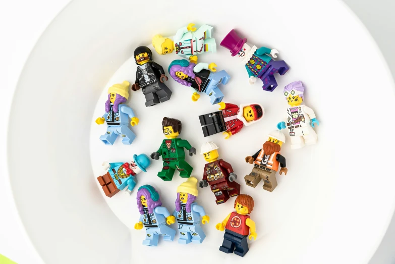 lego minifigures on the side of a plate
