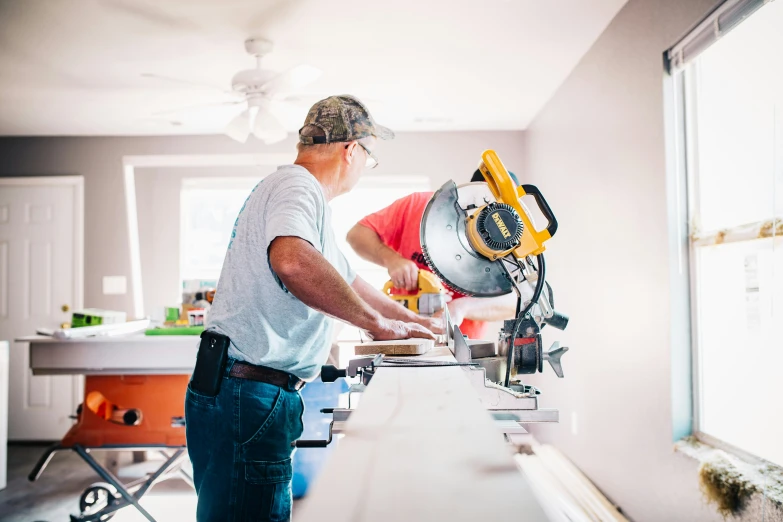 a man operating a machine in the kitchen