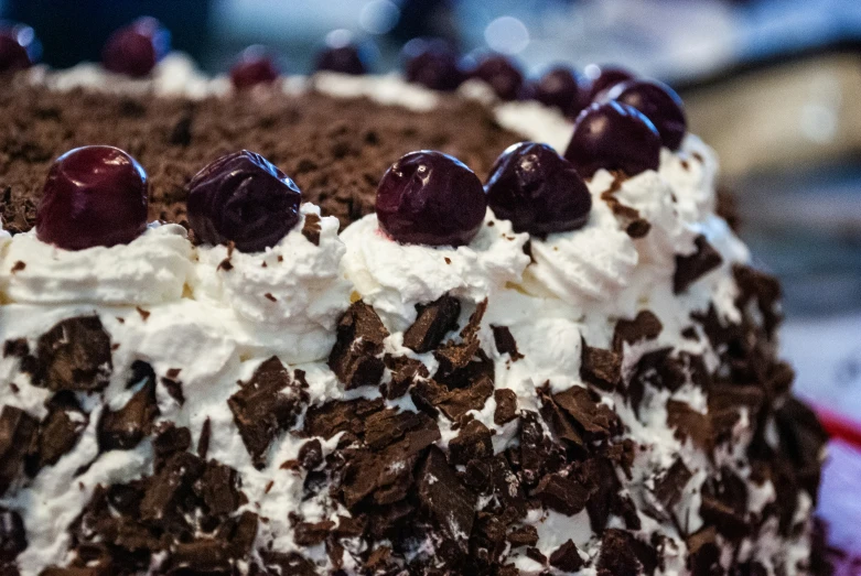 an image of a very fancy cake that looks like it has cherries