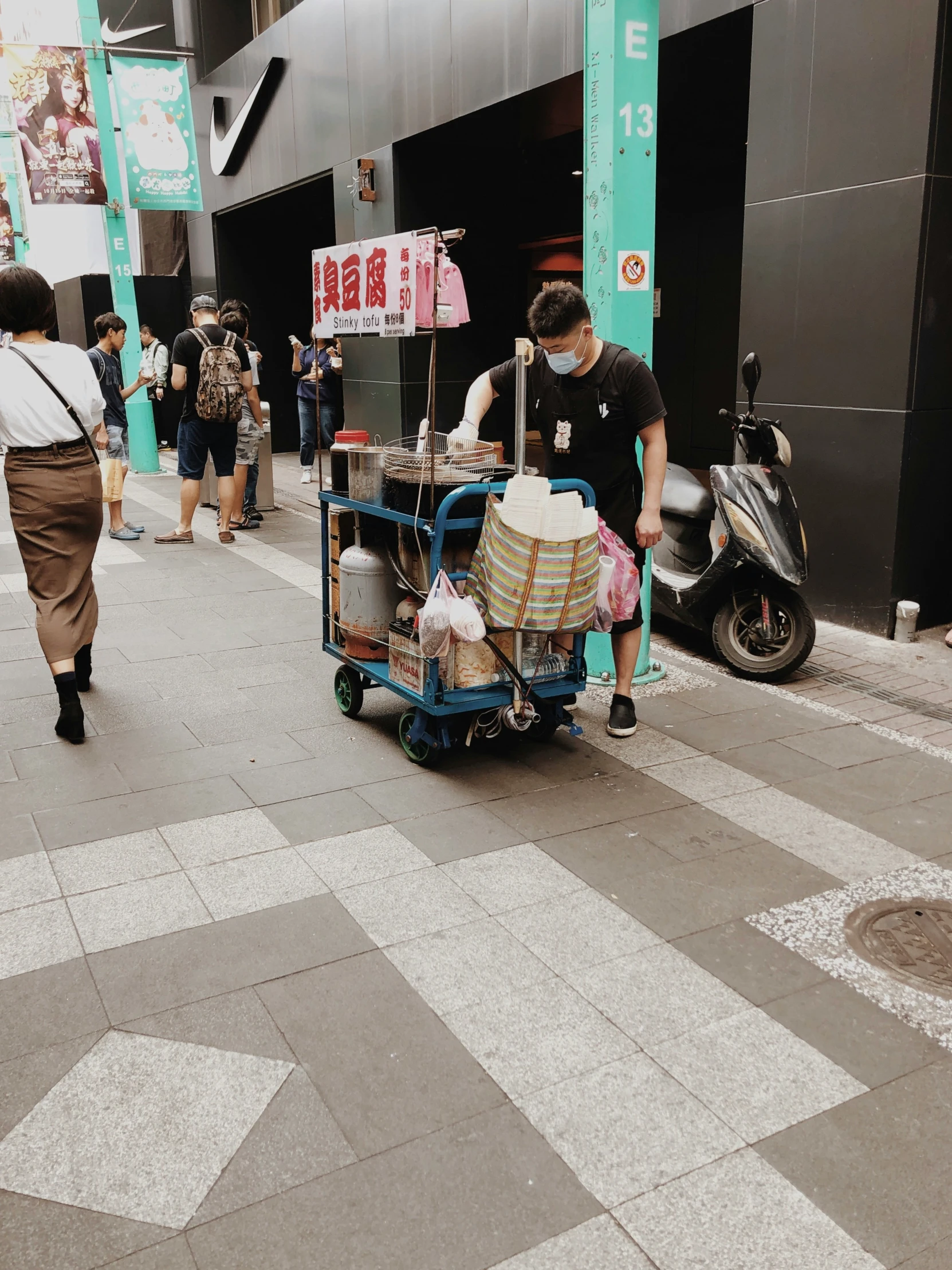 a man is selling food from a cart