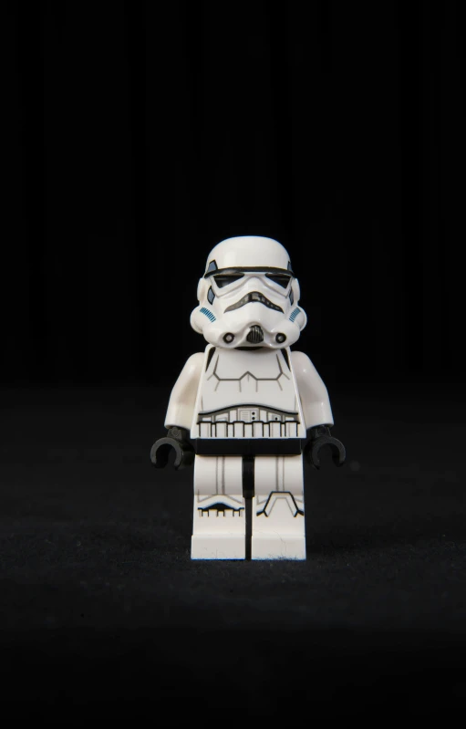 small lego star wars storm trooper figure in black background