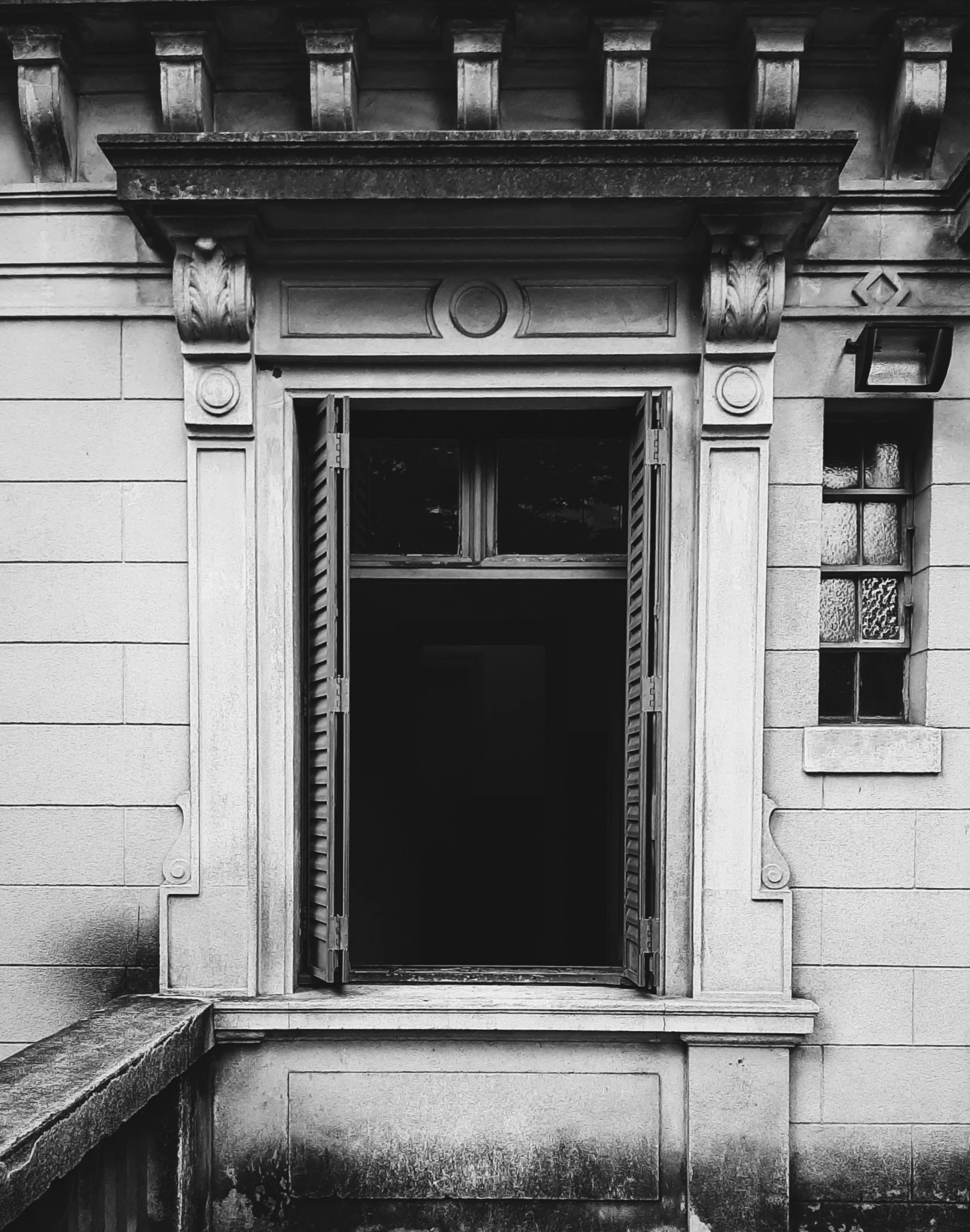 a building with an open door is shown in this black and white po