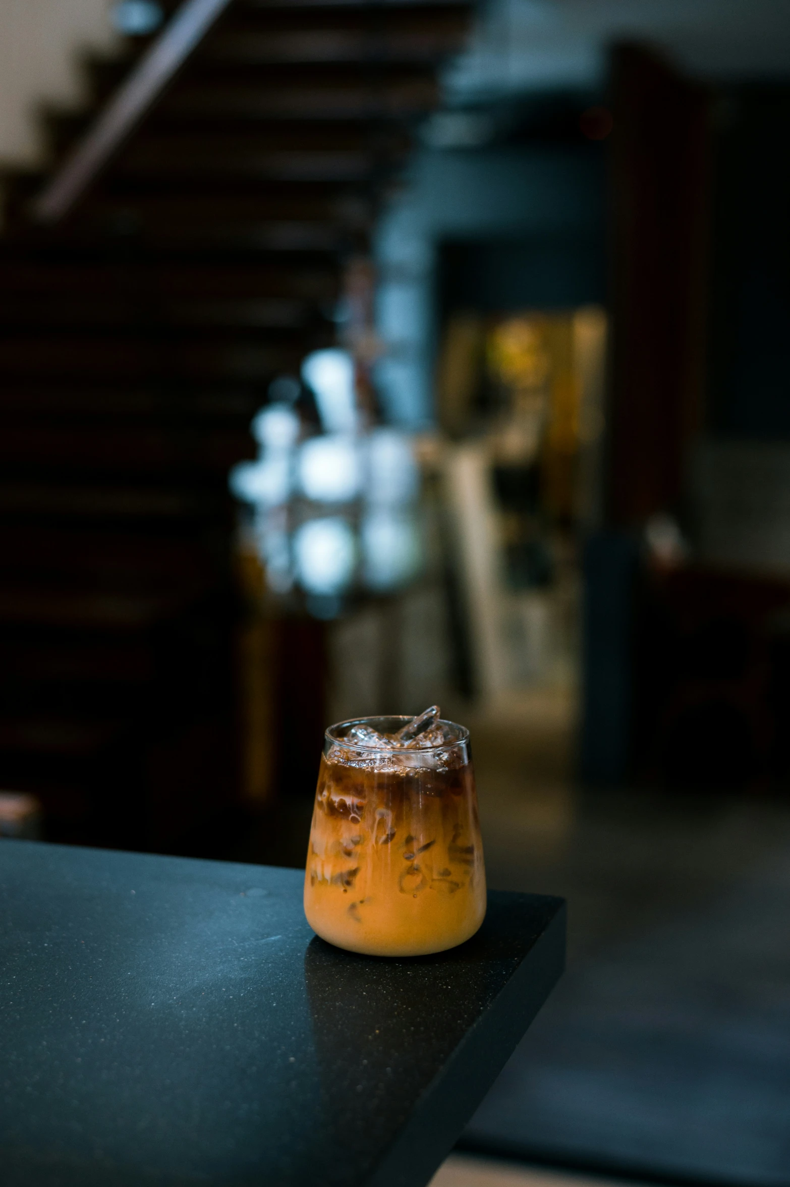 a glass jar filled with some liquid on top of a counter