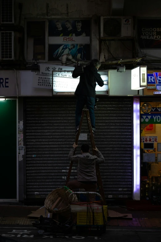 a man is balancing on the top of two other items