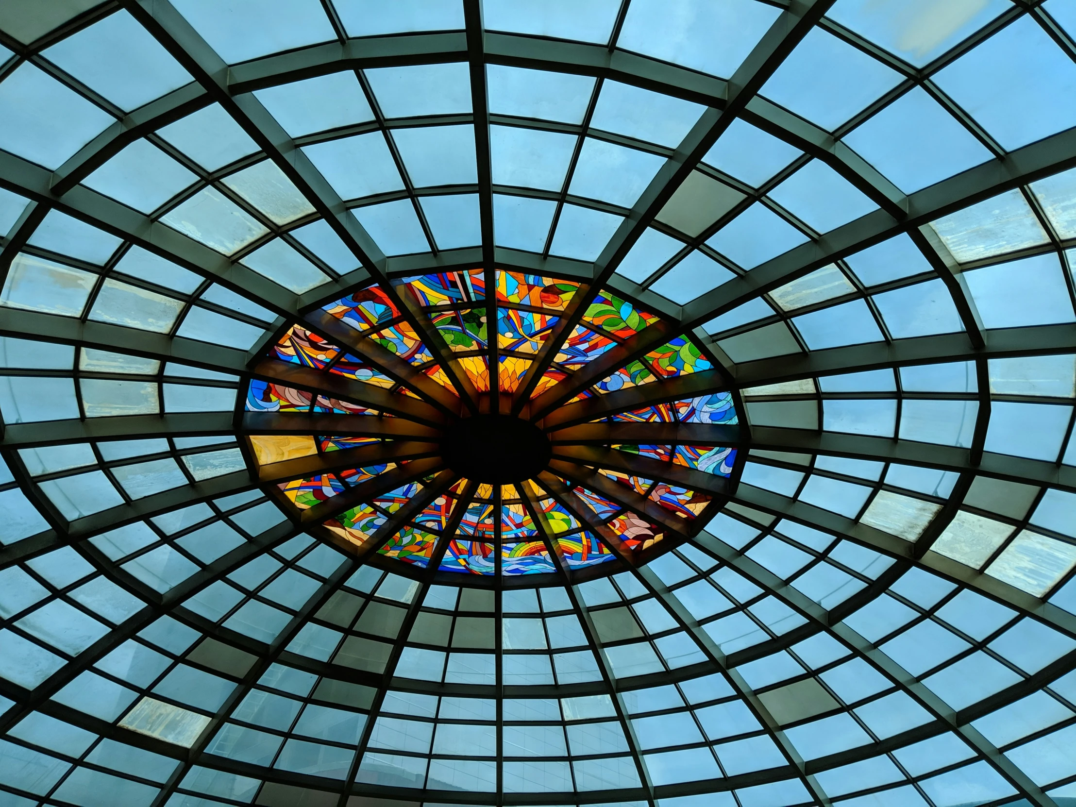 a view of a stained glass dome in an architectural building