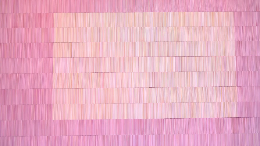 a pink and beige wall that looks like bricks