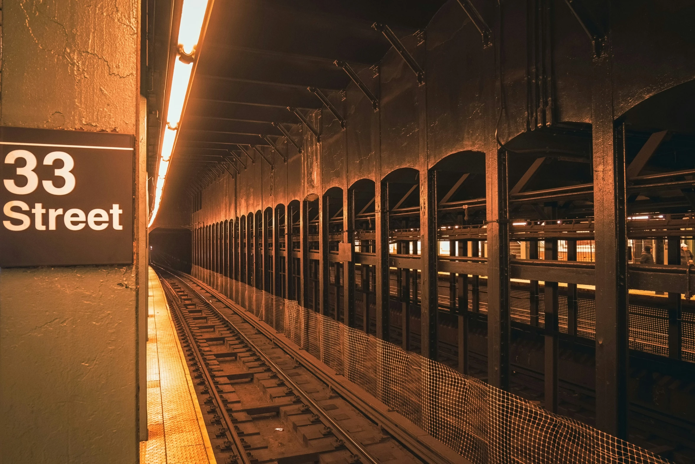 a train on the tracks in a subway