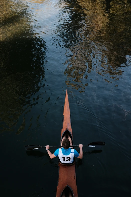 the man is rowing his boat in the water