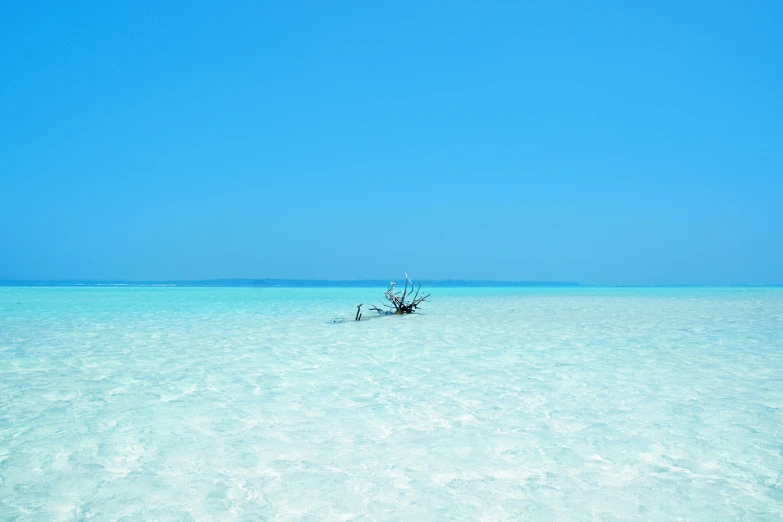 a lone boat in the middle of the ocean