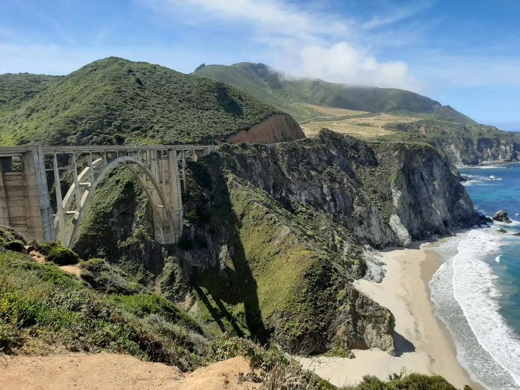 a view from the cliff above looking at a bridge