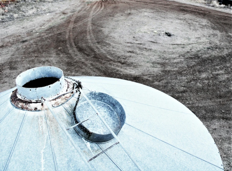 the hose attached to the side of the tank