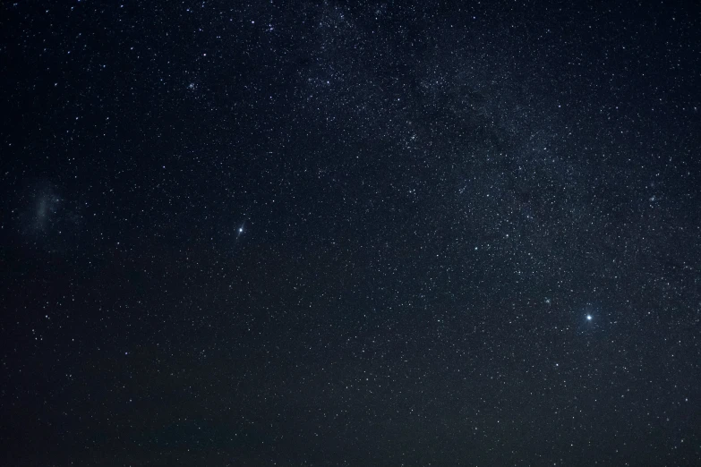 night sky with stars over a green field