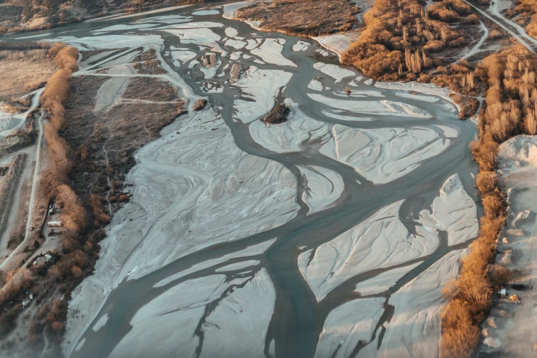 aerial view of snow and ice with curving road