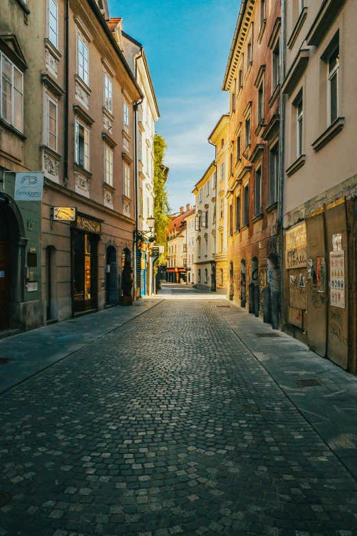 an old city street with brick buildings on the side