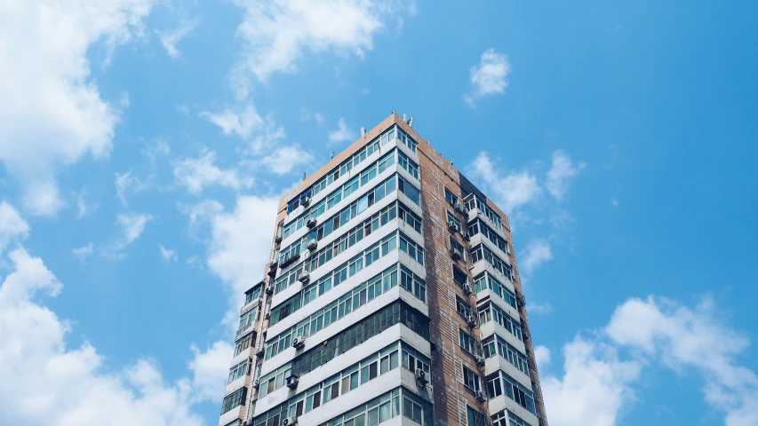 a tall building is high in the clouds