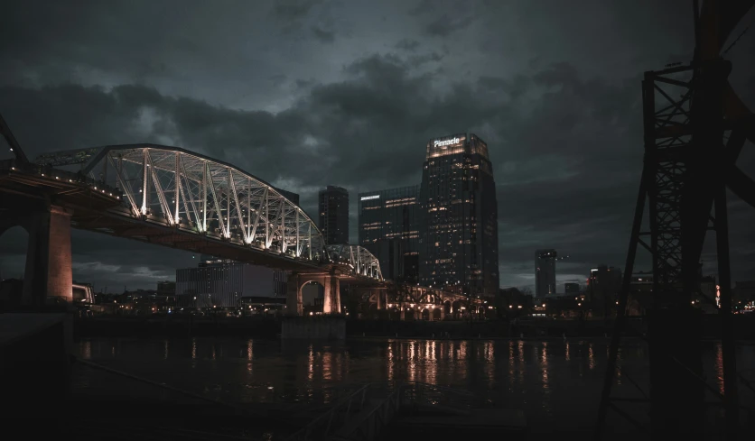 night view of city and illuminated bridges in a harbor