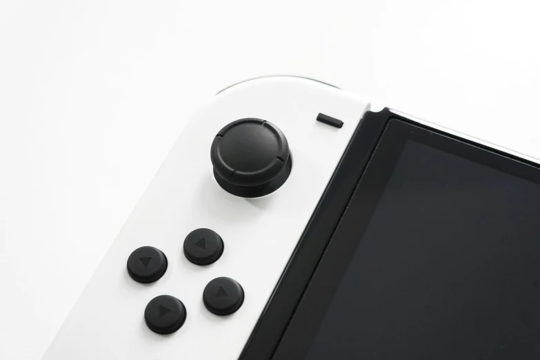 a white game controller sitting on top of a table