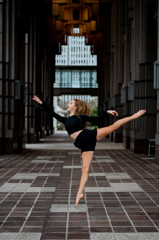 a woman is leaping and doing a trick