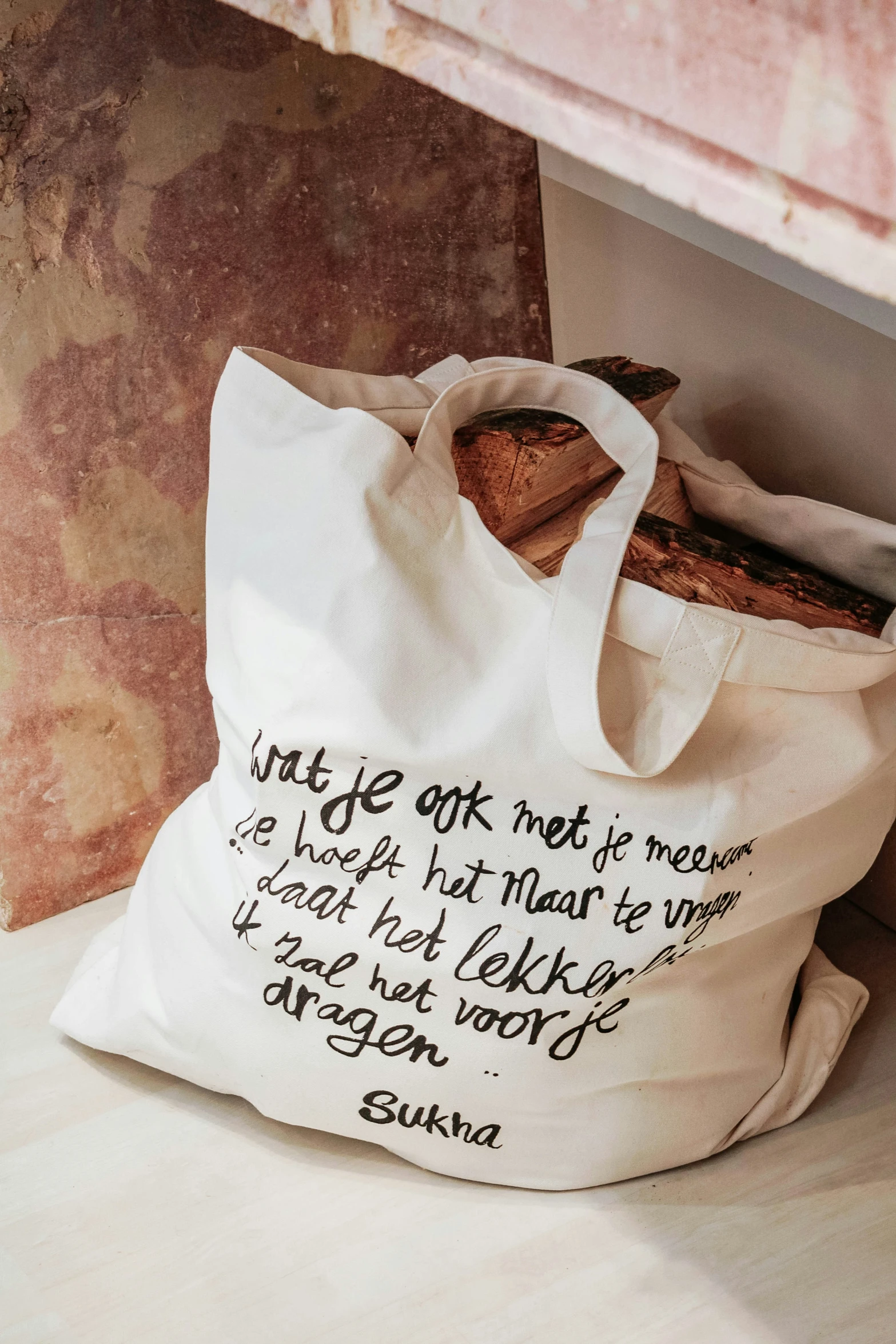 white bag with an inspirational message on it