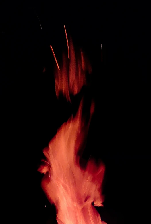 red fire is glowing on a black background