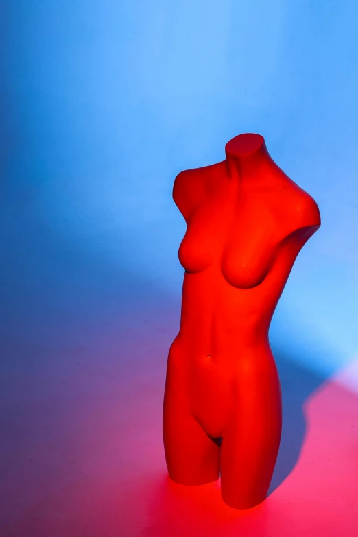 an artistic po of a red female mannequin