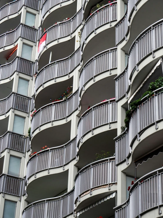 an apartment building in switzerland with balconies and balconies