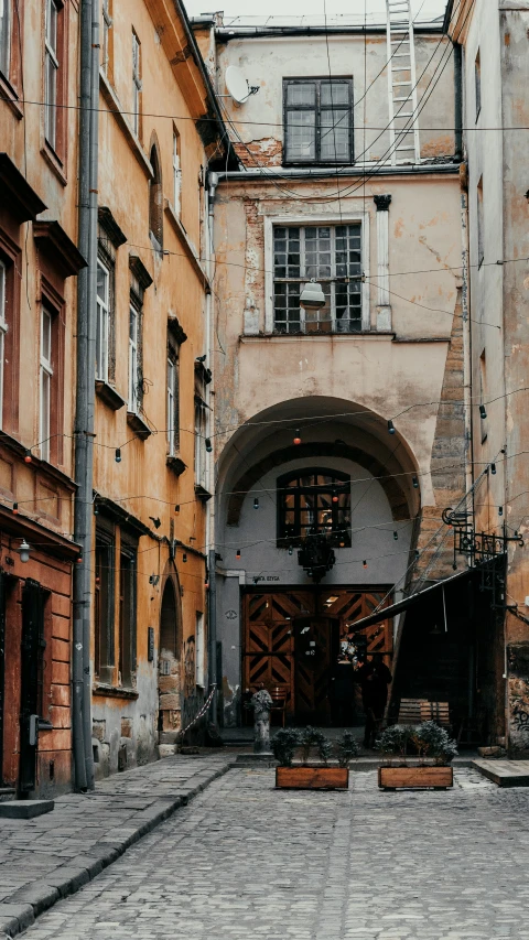 the courtyard of an old building has a large door