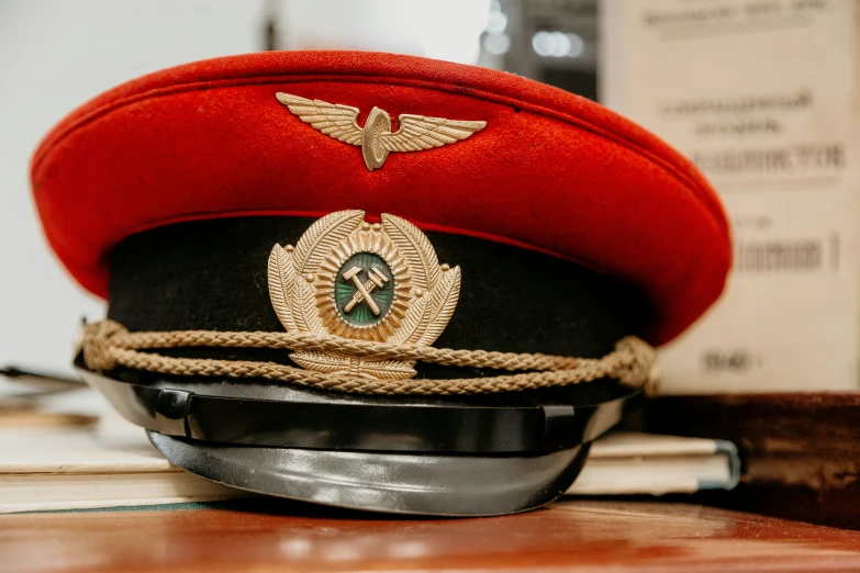 red hat sitting on top of a metal object