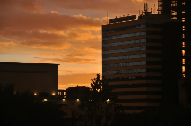 a view of the sky, buildings and trees