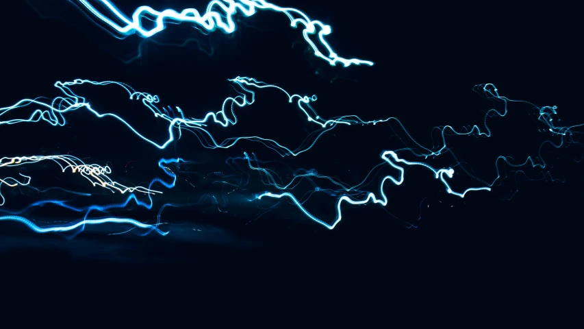 blue and white light streaks in the sky