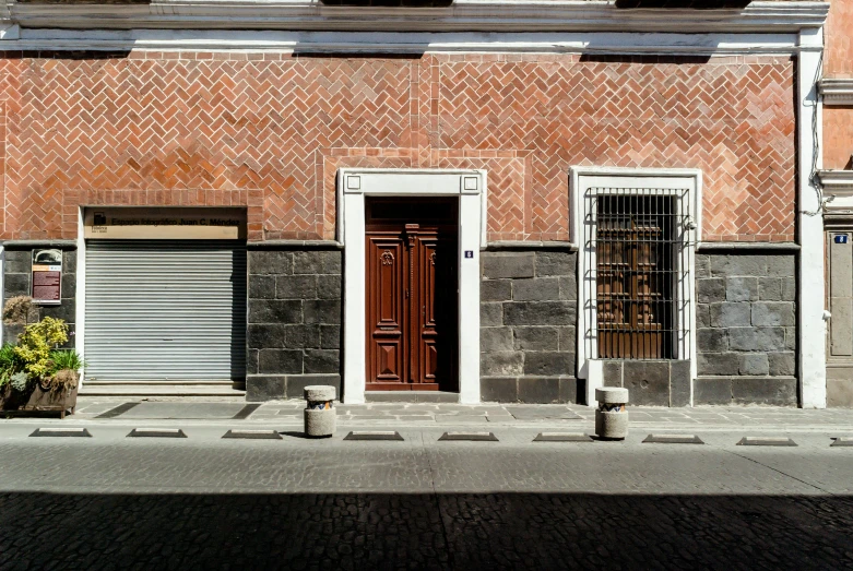 some tall buildings with red doors and windows