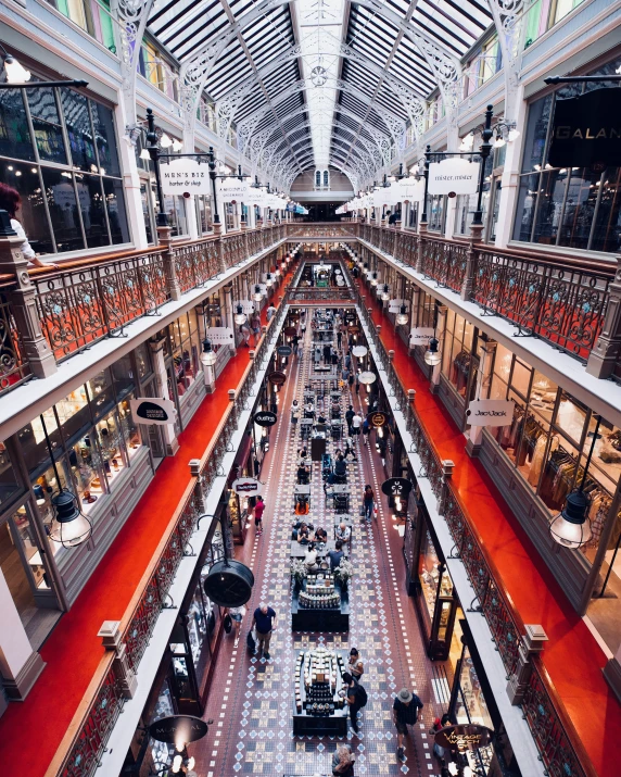 people are walking around in a shopping mall