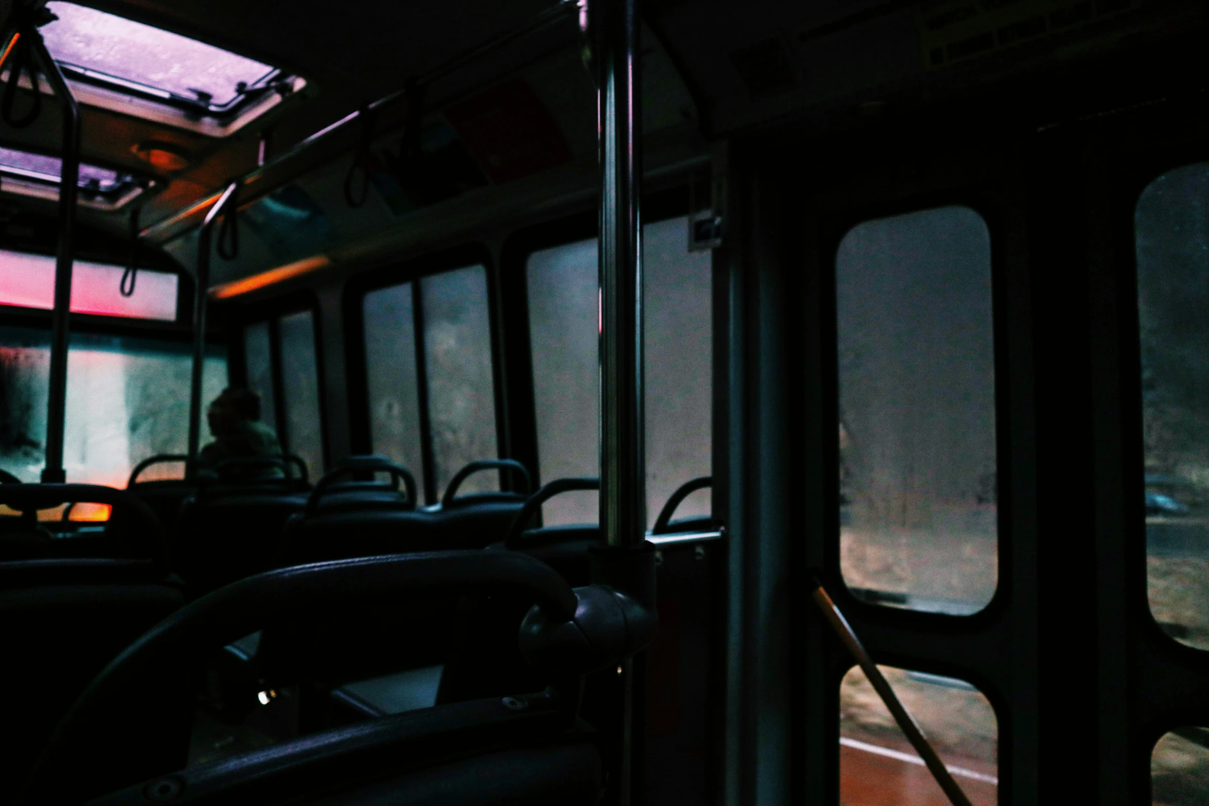 a bus is seen through the window at night