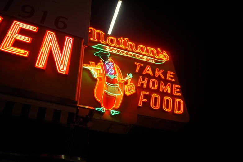 there is a lighted neon sign that says, the banana restaurant