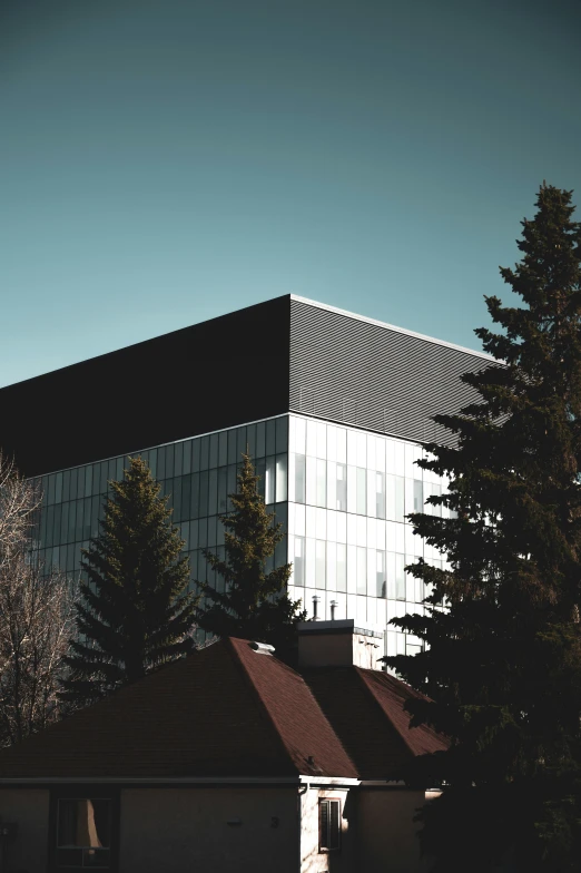 a building on the corner with trees around it