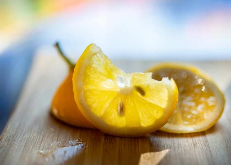 a half eaten lemon sits on top of the table