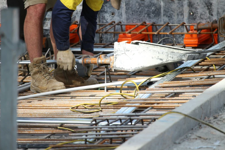 an image of workers fixing pipe structure