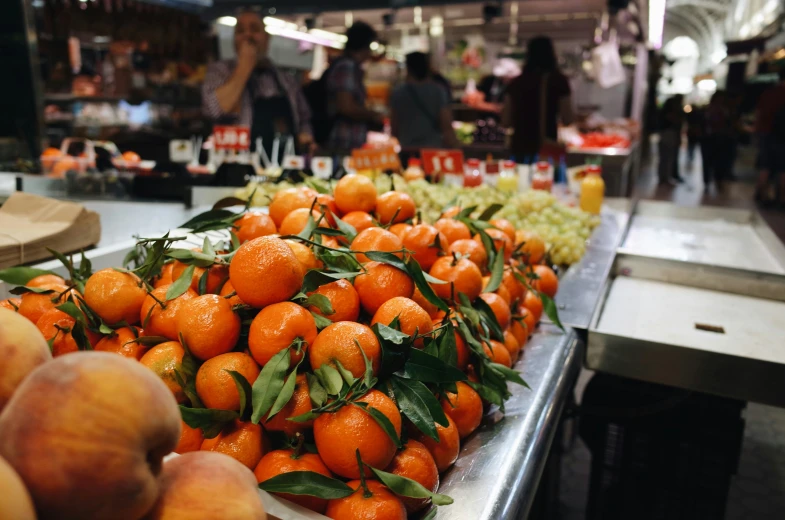 a table that has some oranges on it