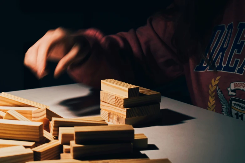 people  wood with wood squares on the table