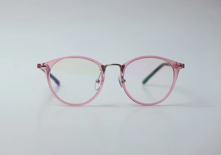 a pair of glasses are lying on a surface